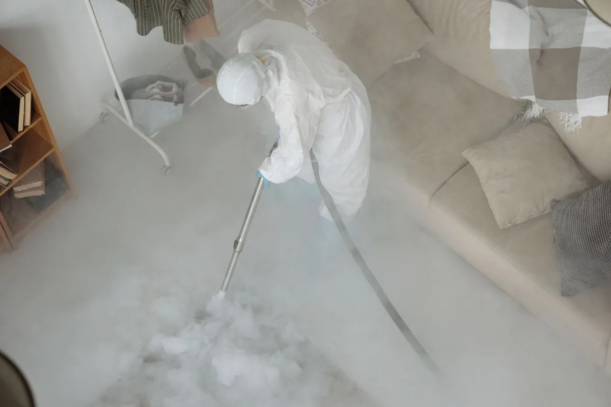 Biohazard cleanup technician in protective equipment, Shaw Heights, CO